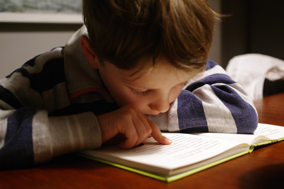 A child deeply focused reading a book